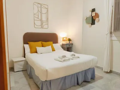 Cama o camas de una habitación en HomeySeville-Duplex con Terraza Santa Cruz 5 pax, Parking Optional