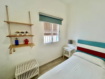Cama o camas de una habitación en Acogedor apt 8pax 4Bdr 2Bth- CozyHomeSevilla2