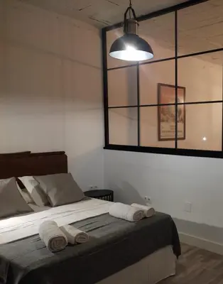 Cama o camas de una habitación en VFT Puerta de Córdoba