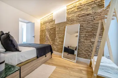 Cama o camas de una habitación en Victoria Suites Apartments