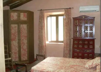 Cama o camas de una habitación en Casa Rural El Chorrillo Cazalla de la Sierra