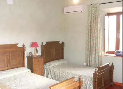 Cama o camas de una habitación en Casa Rural El Chorrillo Cazalla de la Sierra