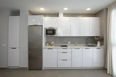Una cocina o zona de cocina en Apartamentos Ribera 19