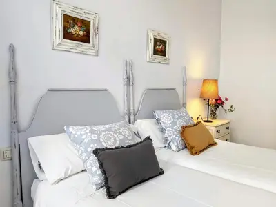 Cama o camas de una habitación en Misterhost Santa Cruz Judería - Acogedor y tranquilo - Casco Histórico