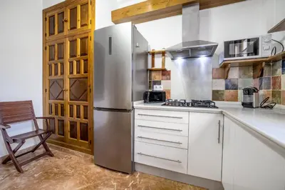 Una cocina o zona de cocina en Apartamento con patio cordobés en San Basilio & Parking