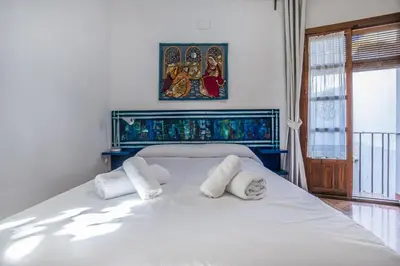 Cama o camas de una habitación en Apartamento con patio cordobés en San Basilio & Parking