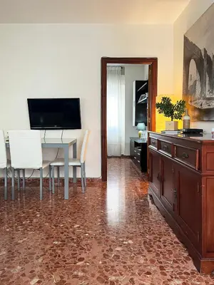Una televisión o centro de entretenimiento en Apartment Wall Center - Aloha Sevilla