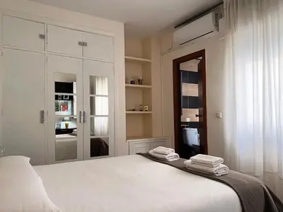Cama o camas de una habitación en Apartment Wall Center - Aloha Sevilla