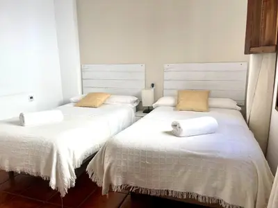 Cama o camas de una habitación en RIBERA SUITE CÓRDOBA