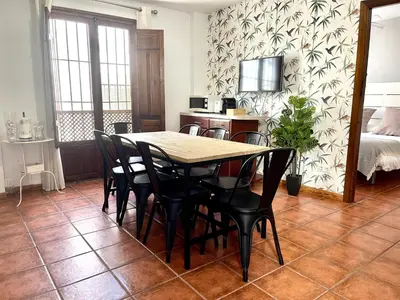 Cama o camas de una habitación en RIBERA SUITE CÓRDOBA