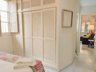 Cama o camas de una habitación en HomeySeville-Bright Apartment at Santa Cruz 4 pax, Parking Optional