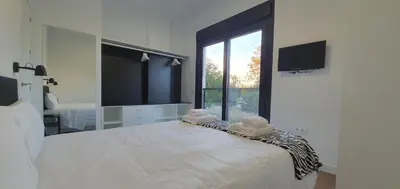 Cama o camas de una habitación en RICARDO APARTAMENTo