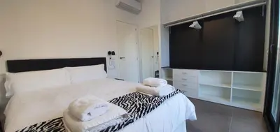 Cama o camas de una habitación en RICARDO APARTAMENTo