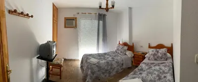 Una televisión o centro de entretenimiento en Apartamentos Coronichi