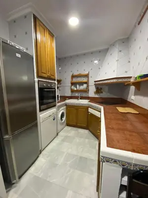 Una cocina o zona de cocina en Fantástico dúplex corazón de la Judería Sevilla