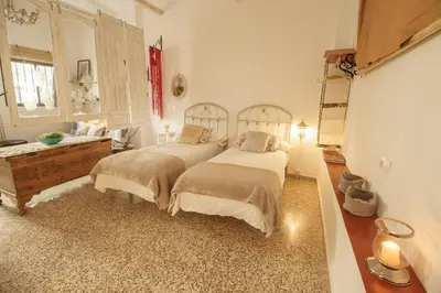 Cama o camas de una habitación en APARTAMENTO CAMINO MOZARABE