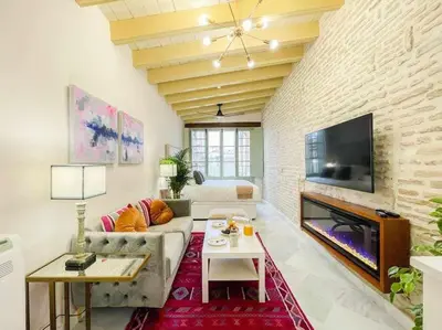 Una televisión o centro de entretenimiento en Juderia de Sevilla VI - Luxury Apartments