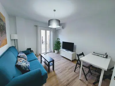 Una televisión o centro de entretenimiento en Sol Centro Apartment B
