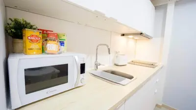Una cocina o zona de cocina en RentalSevilla Escuelas Pías