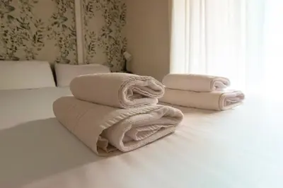 Cama o camas de una habitación en Rentalsevilla Alhóndiga
