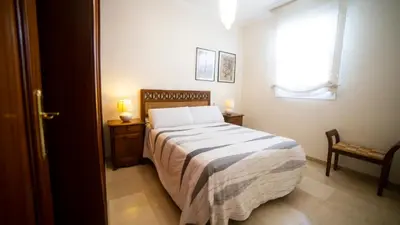 Cama o camas de una habitación en Vistas a la catedral y el río, Parking free