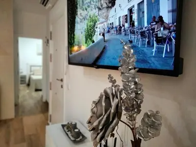 Una televisión o centro de entretenimiento en Ático CARMEN