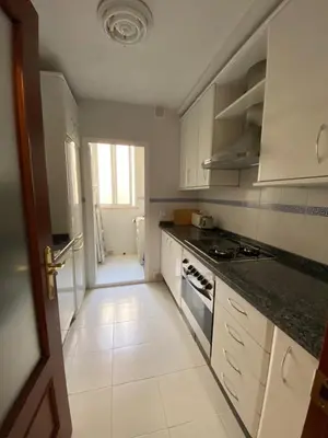 Una cocina o zona de cocina en fantástico apartamento con parking avenida de cadiz