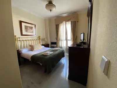 Cama o camas de una habitación en fantástico apartamento con parking avenida de cadiz