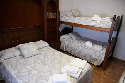 Cama o camas de una habitación en Casa Rural LA ENCINA