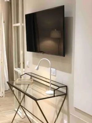 Una televisión o centro de entretenimiento en Apartamento Premium en el Centro de Sevilla