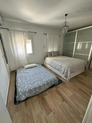 Cama o camas de una habitación en ATICO AMPLIO Y LUMINOSO