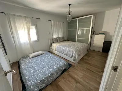 Cama o camas de una habitación en ATICO AMPLIO Y LUMINOSO
