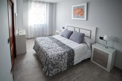 Cama o camas de una habitación en Apartamentos Maquinista