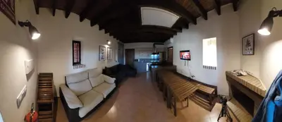 Una televisión o centro de entretenimiento en Casa Rural del GUARDAGUJAS