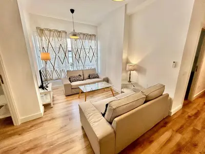 Zona de estar de Acogedor apt 6pax 3Bdr 2Bth - CozyHomeSevilla5