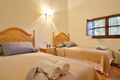 Cama o camas de una habitación en Casa Rural COMPLETA Finca Los Conventos en Adamuz; Córdoba