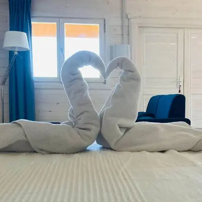 Cama o camas de una habitación en Hermoso Bungalow de madera