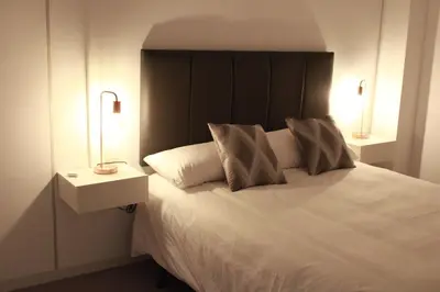 Cama o camas de una habitación en Casa Rural Plaza Santa Ana