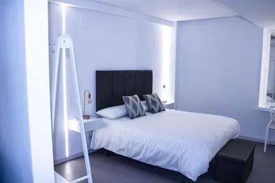 Cama o camas de una habitación en Casa Rural Plaza Santa Ana