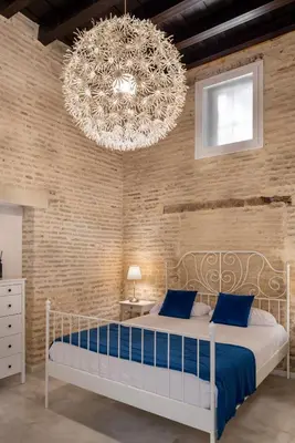 Cama o camas de una habitación en Unika Homes Hombre de Piedra
