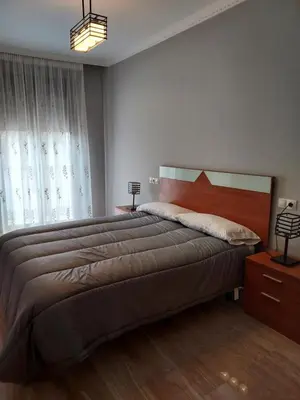 Cama o camas de una habitación en Apartamento La Muralla