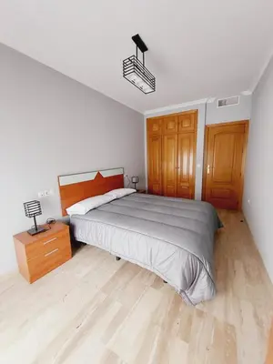 Cama o camas de una habitación en Apartamento La Muralla