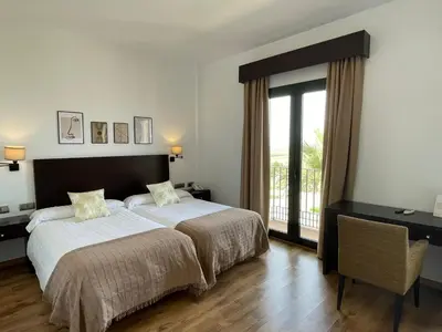 Cama o camas de una habitación en Hotel Cuatro Vientos