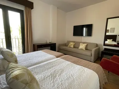 Cama o camas de una habitación en Hotel Cuatro Vientos
