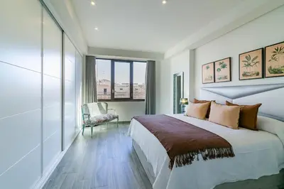 Cama o camas de una habitación en Geysotur Gran Capitán Uno