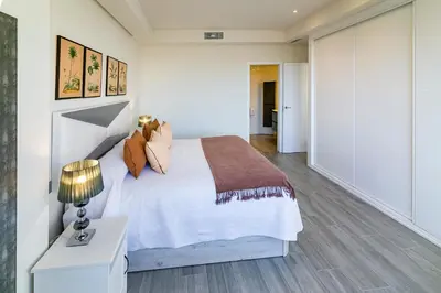 Cama o camas de una habitación en Geysotur Gran Capitán Uno