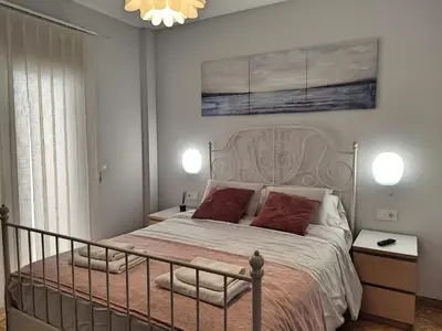 Cama o camas de una habitación en Amplio y Moderno Apartamento Lorenzo Ferreira