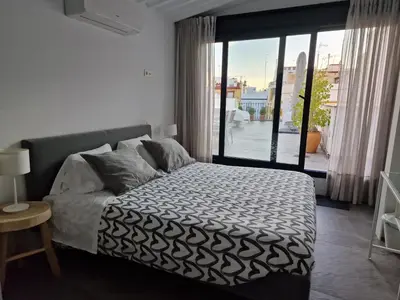 Cama o camas de una habitación en Atico en Puerta Osario