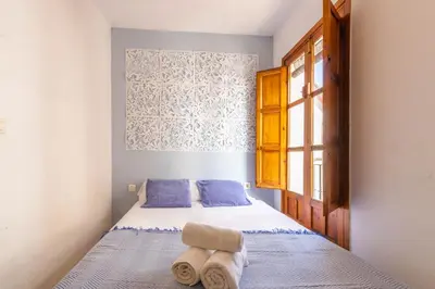 Cama o camas de una habitación en Apartamento Ilusión Andaluza