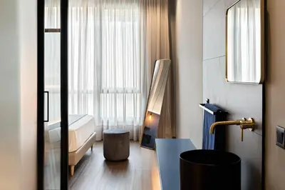 Cama o camas de una habitación en Muralla Sevilla Suites By Lola